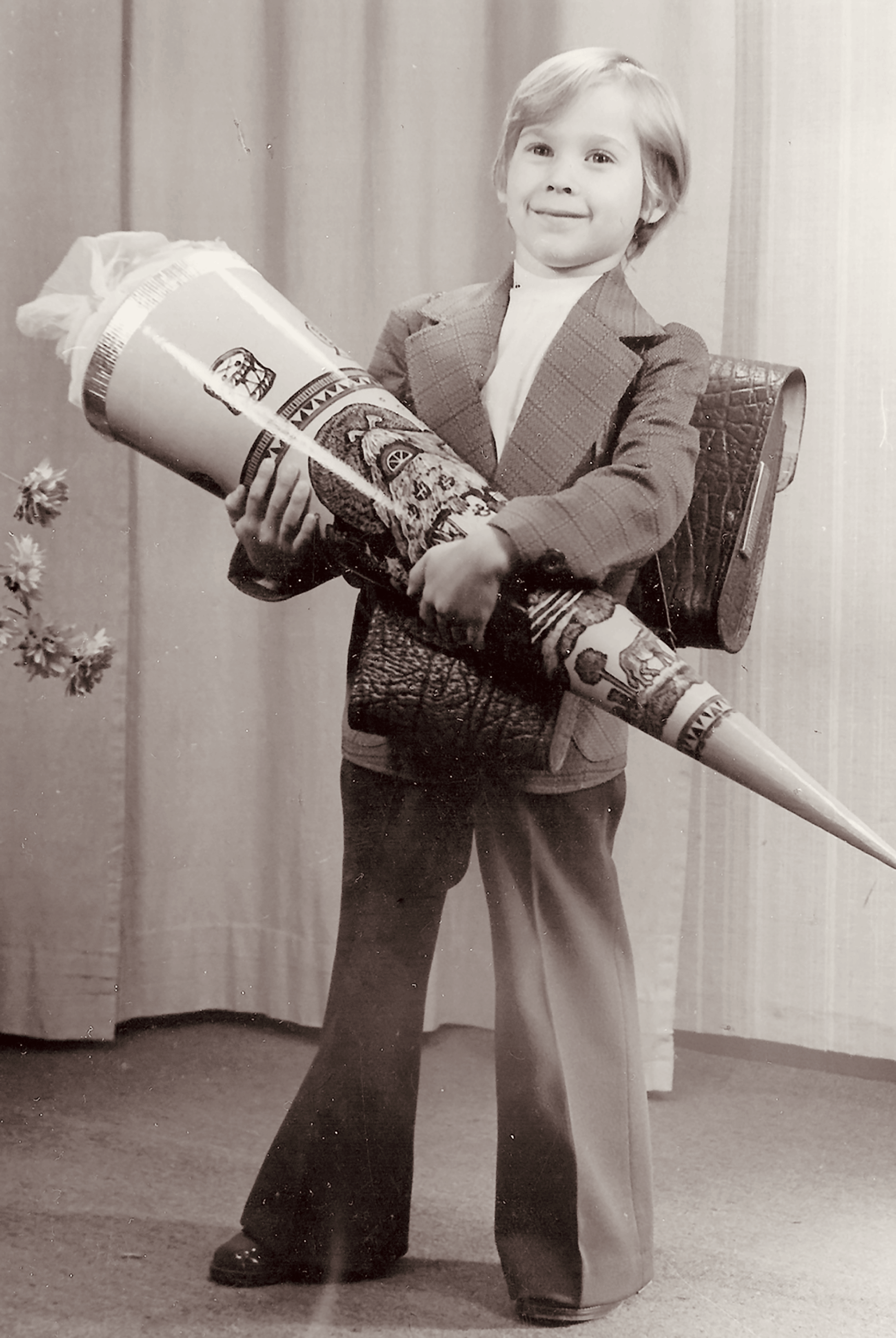 Mario Obst on his first day at school, holding a large cone of sweets